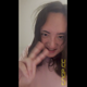 Emi stands in pajamas with her bare ass to the camera and lets out a soft standing shit and an airy fart, then smiles into the camera. Vertical format video. Over 5 minutes.